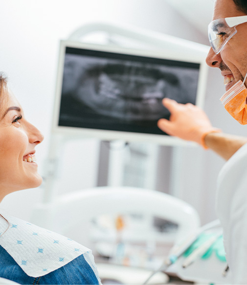 dentist explaining an x-ray to a patient