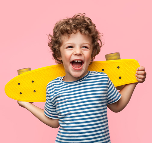 happy young boy with a skateboard