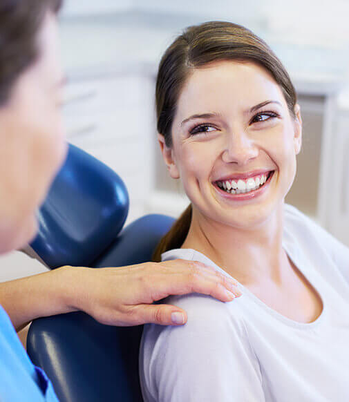 smiling woman in dental chair